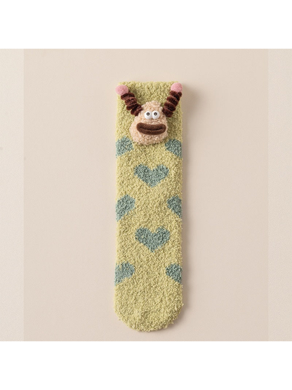Teal Hearts fuzzy crew sock with cartoon face applique, full view