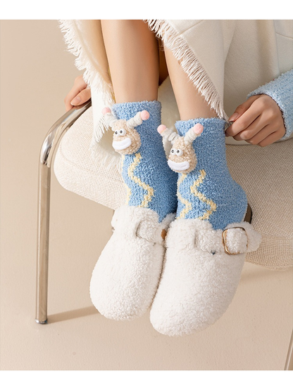 Blue Waves fuzzy cartoon crew socks worn while seated