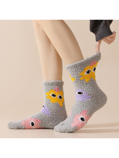 Gray cartoon-motif crew socks worn in a side view