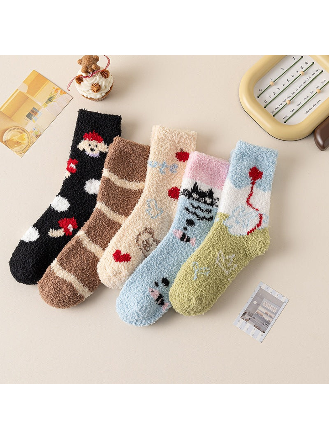 Five fuzzy crew sock styles arranged together on a tabletop