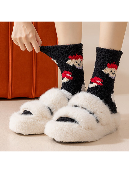 Black gnome and mushroom fuzzy crew socks worn with slippers