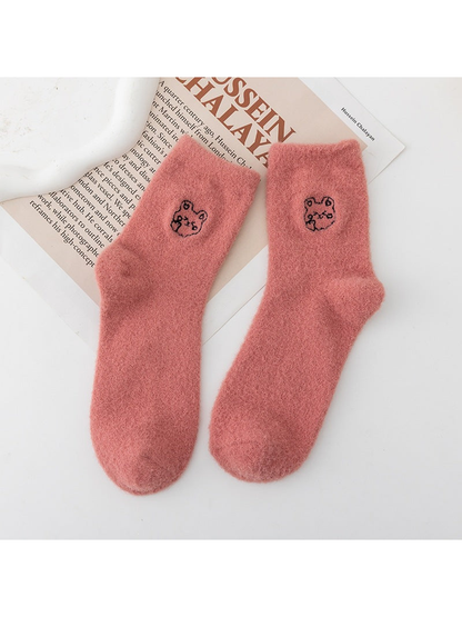 Dusty Pink fuzzy crew socks with small outlined animal-face motifs