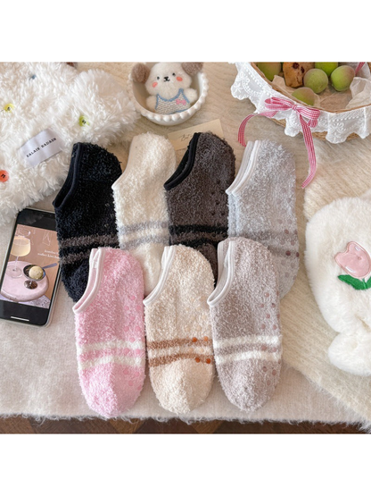 Assorted fuzzy-textured low-cut socks displayed together
