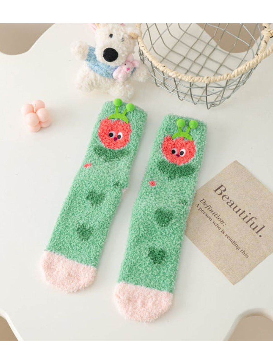 Red Character fuzzy socks with raised green pom-pom accents