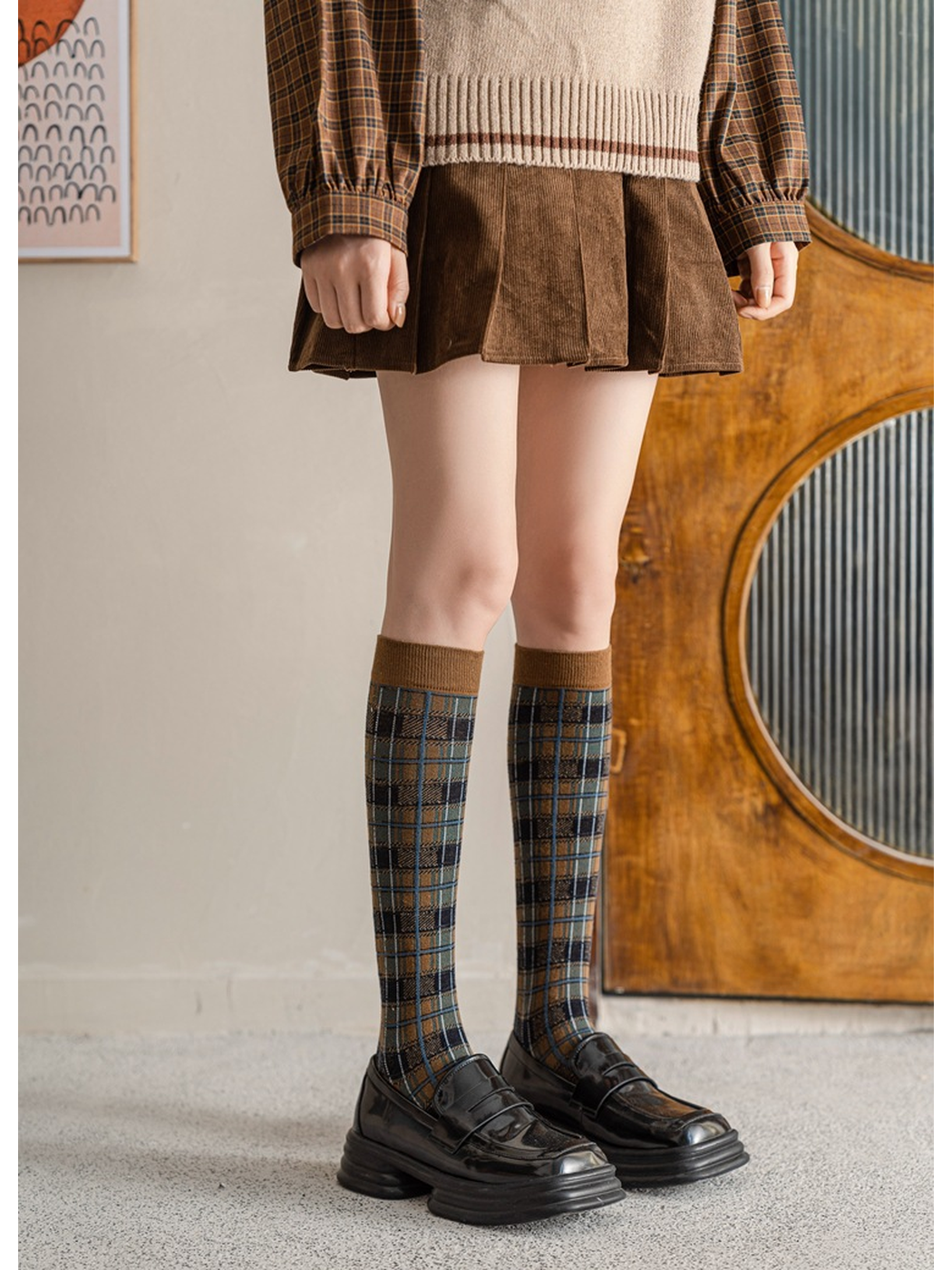 Dark Khaki plaid knee-high socks styled with black loafers