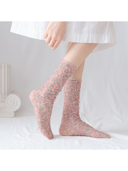 Dusty Pink floral lace-mesh socks worn in a side view
