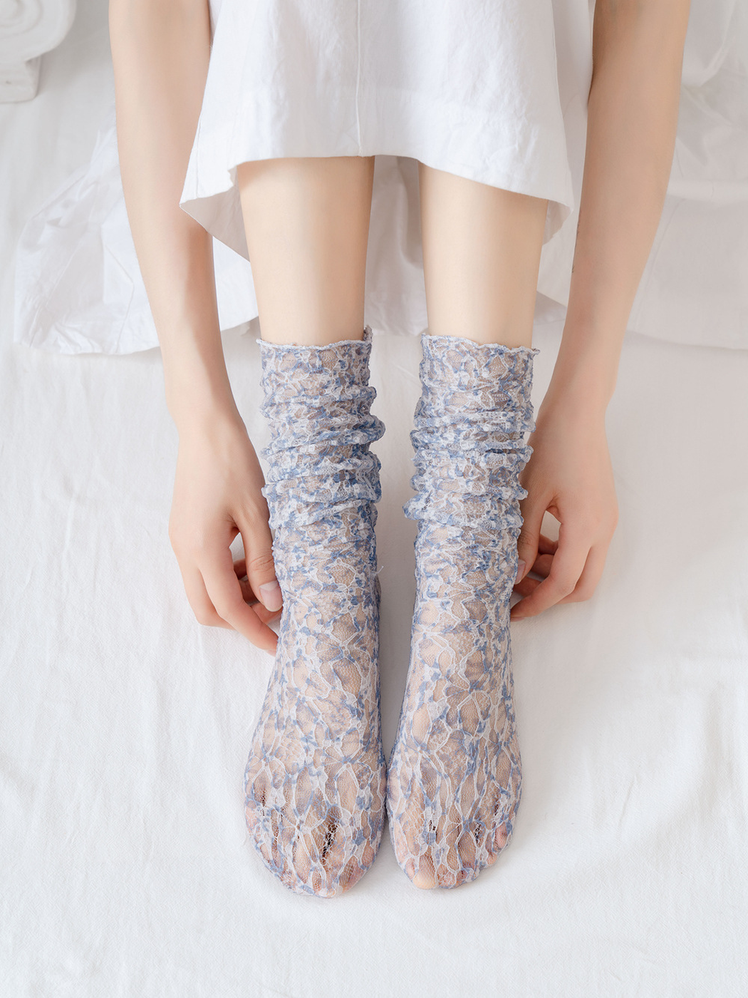 Gray Blue floral lace-mesh socks worn in a front view