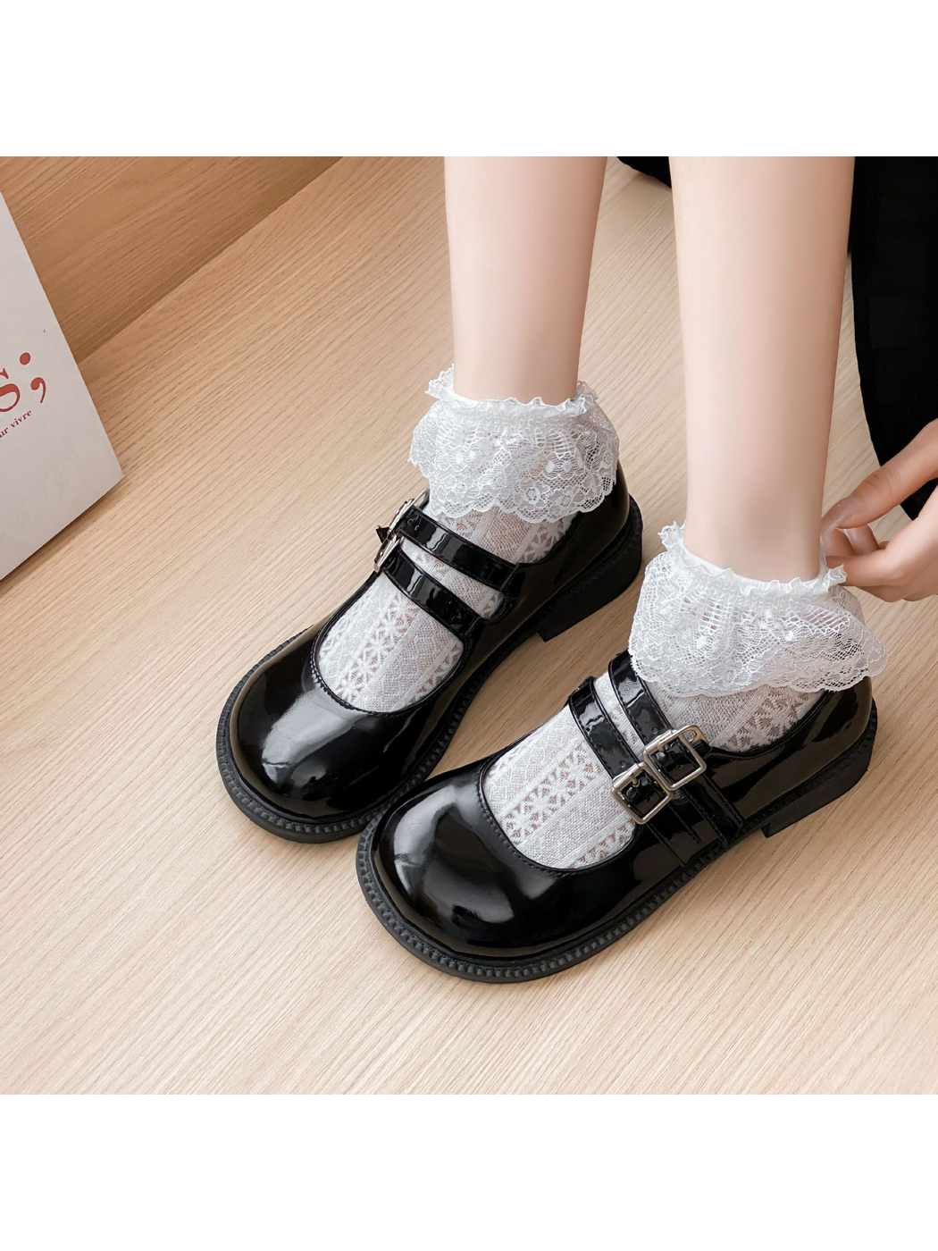 White Lace ankle socks styled with black double-strap shoes