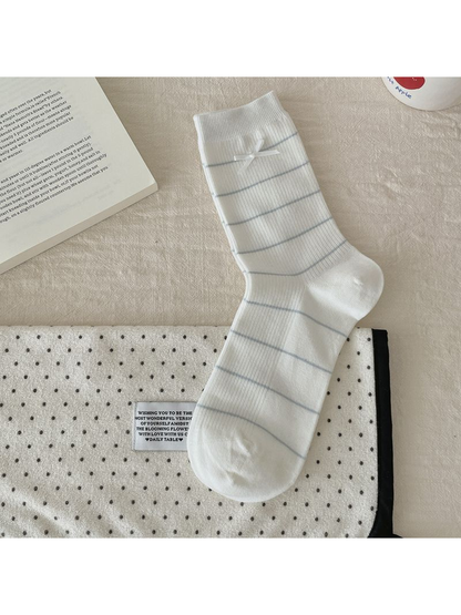 Striped Bow style white crew sock, laid flat