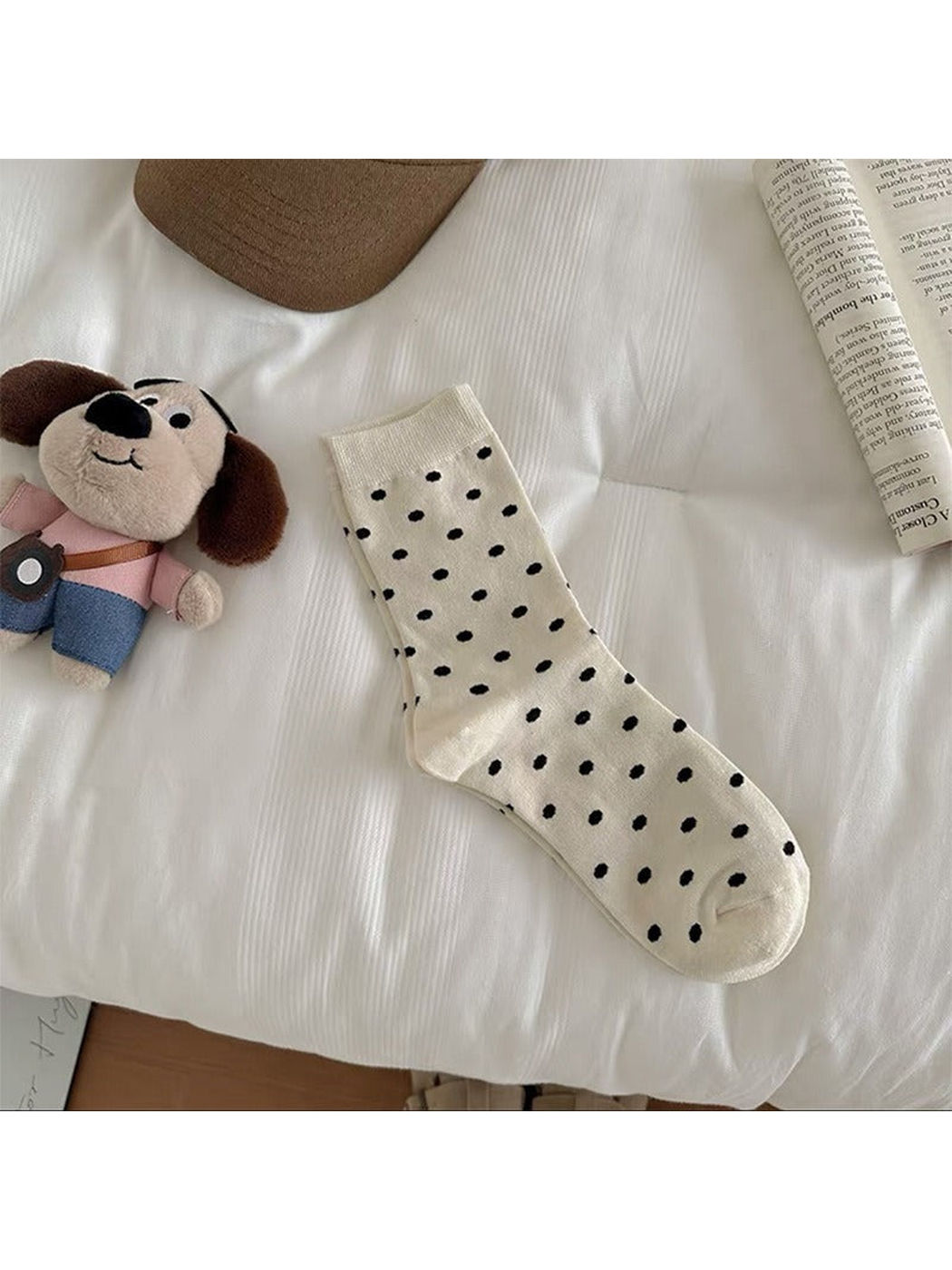 Ivory Dots crew sock with black polka dots and ribbed cuff