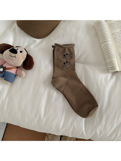 Coffee Duo crew sock with two outlined dog motifs