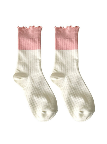 Dusty Pink and ivory two-tone ribbed socks on a white background