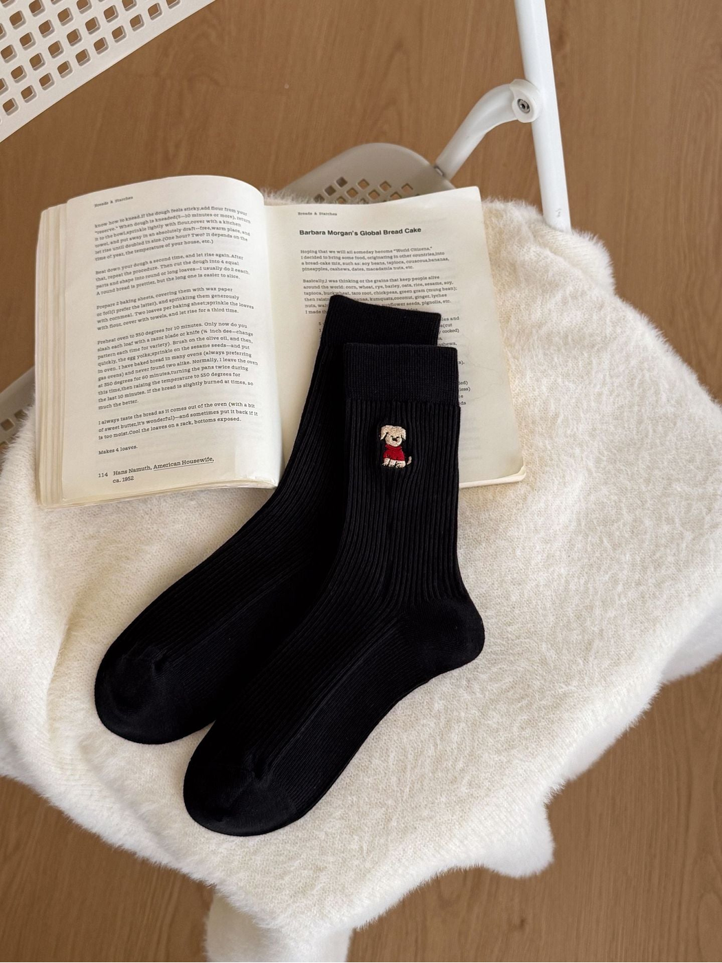 Black ribbed crew socks with a small embroidered dog motif