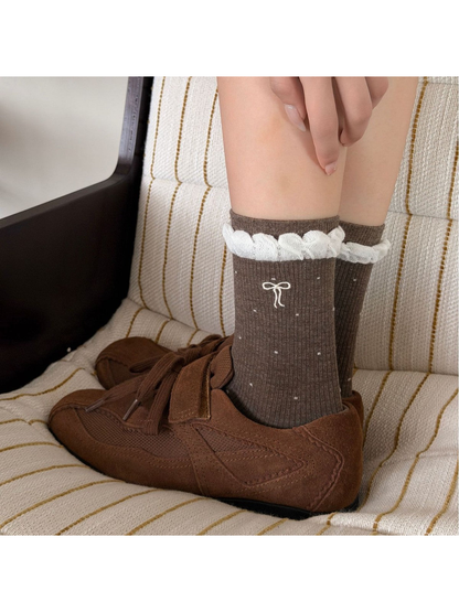Dark Coffee dotted socks with white ruffled cuffs styled with brown shoes