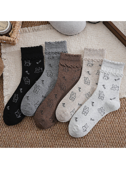 Light gray, beige, brown, dark gray and black crew socks displayed together