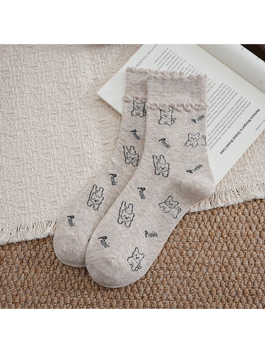 Beige crew socks with cartoon dog pattern and ruffled cuffs