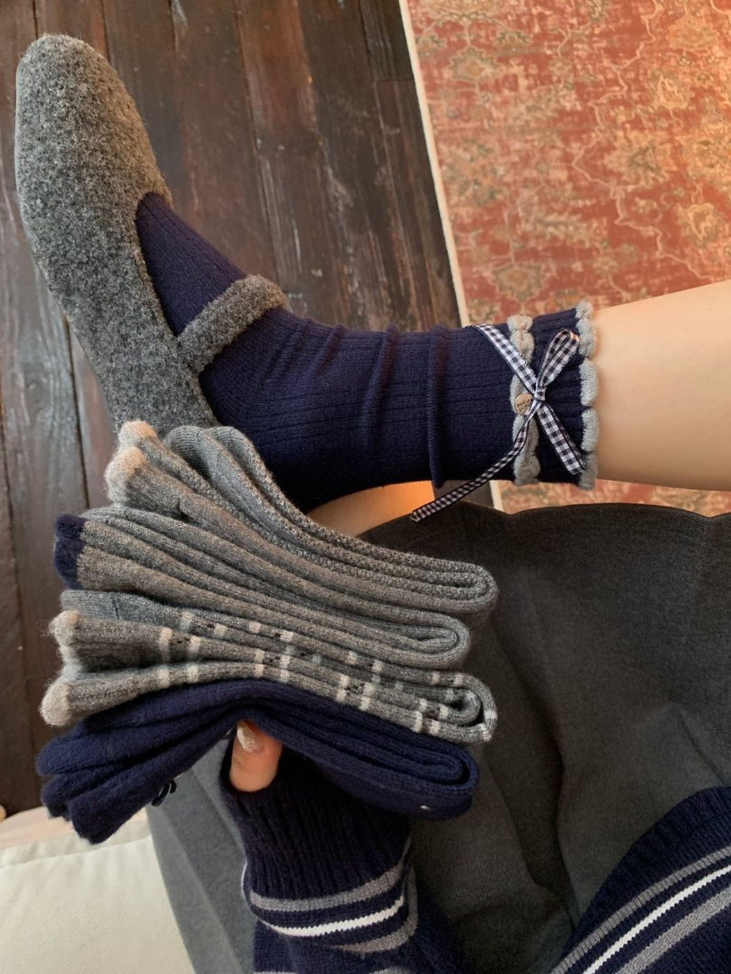 Navy Gingham Bow crew sock worn with coordinating styles stacked in hand