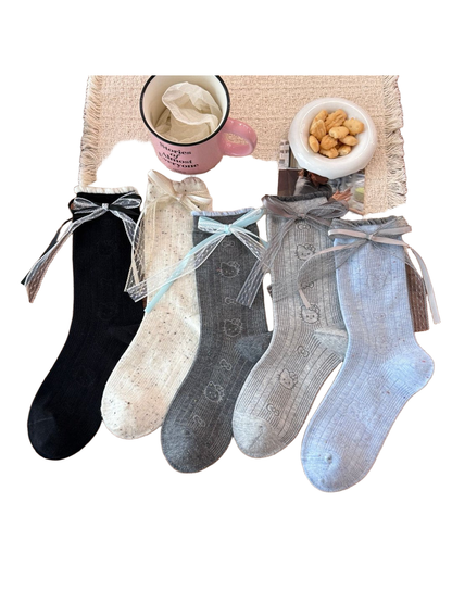 Five ribbed crew sock styles with ribbon-and-lace cuff bows