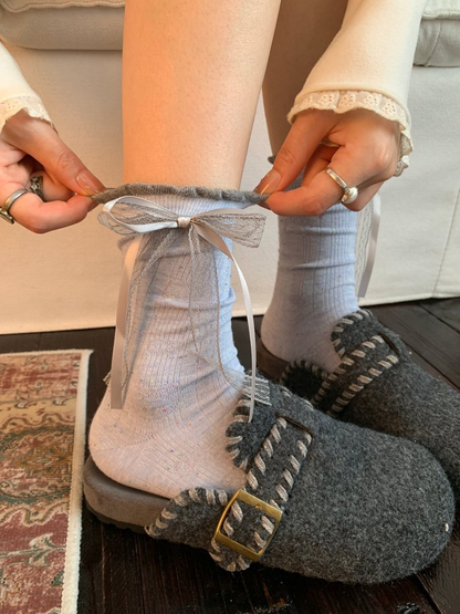 Blue Cat crew socks worn with gray felt slippers