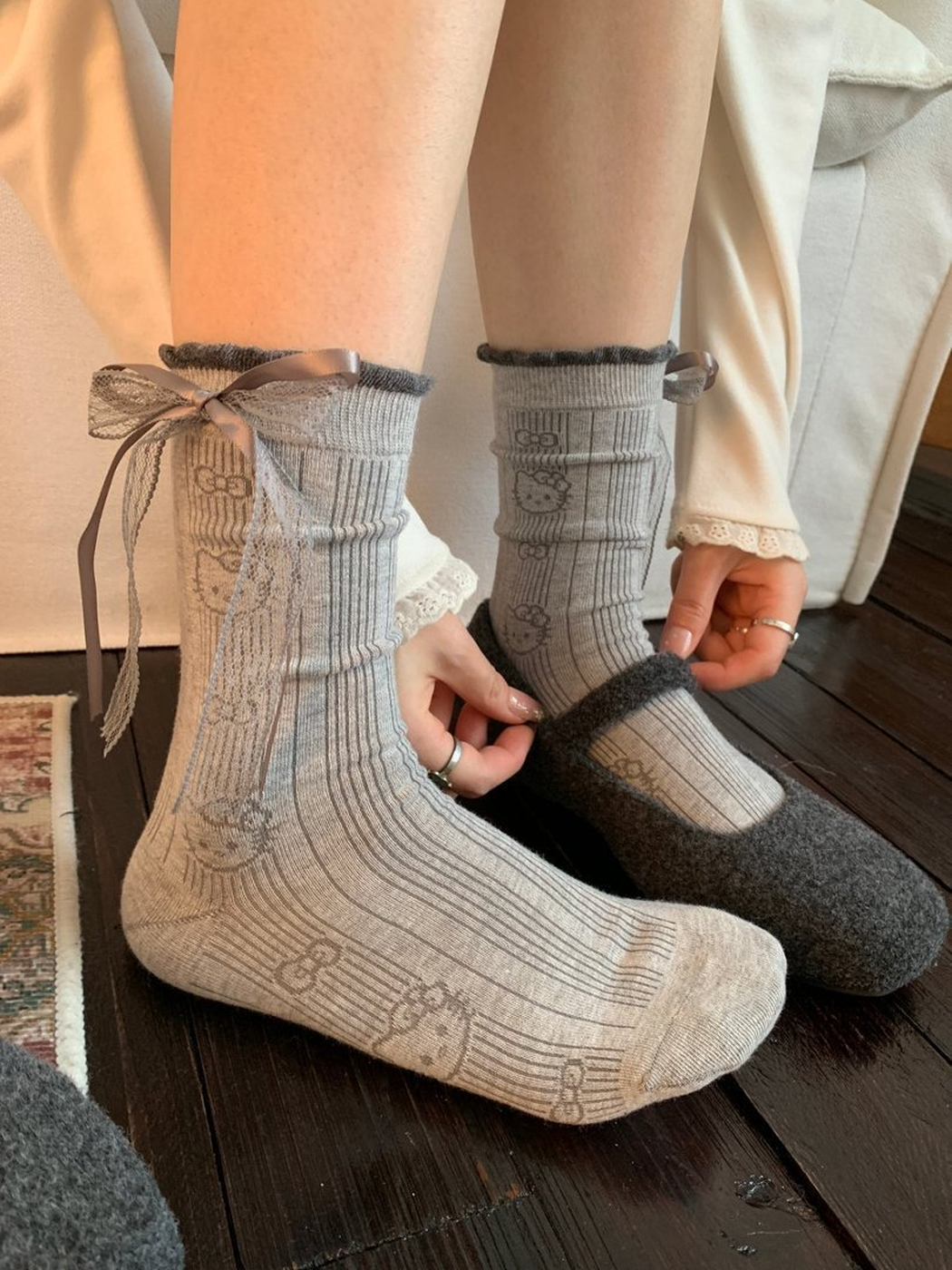 Heather Cat ribbed crew socks worn with gray felt slippers
