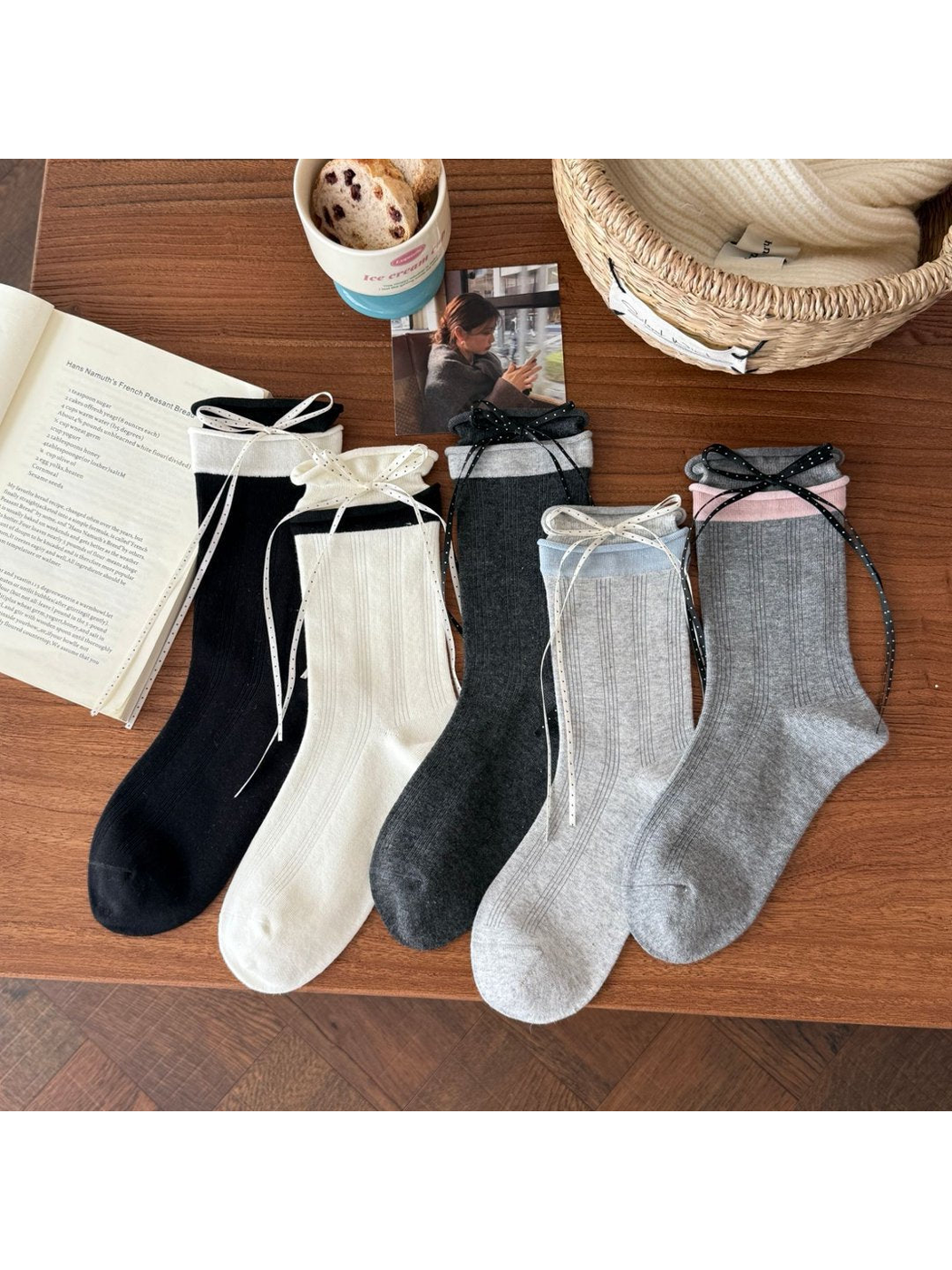 Ribbon-trim crew socks in five color combinations arranged on a wooden table
