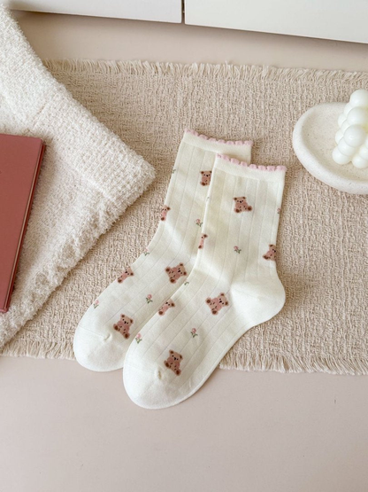 Ivory crew socks with teddy bears, small flowers and pink ruffled cuffs