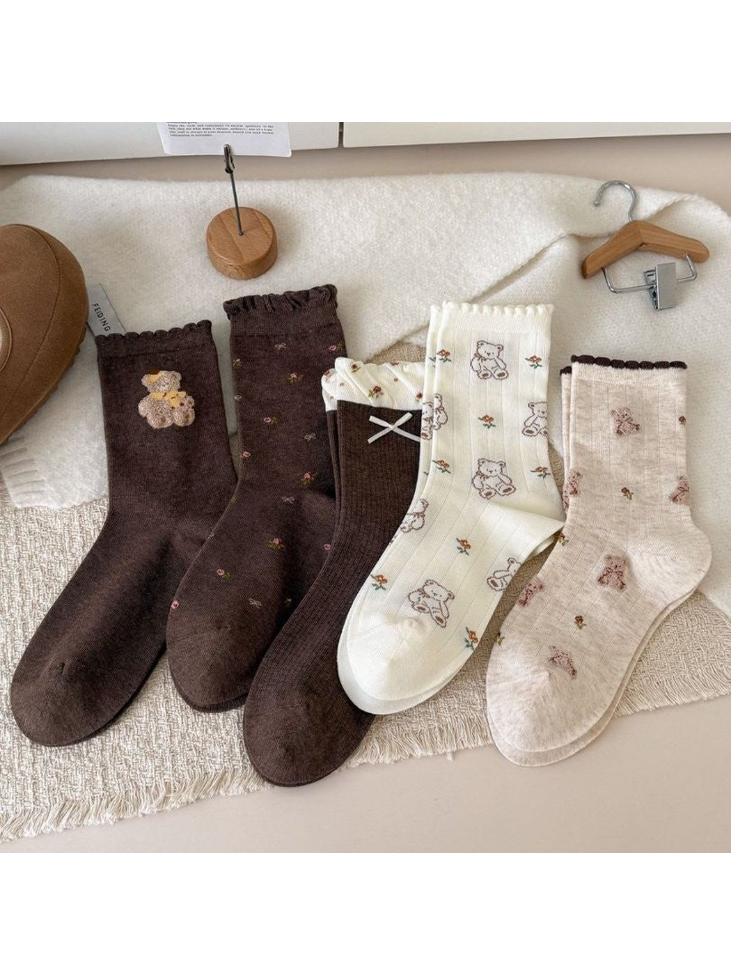 Five patterned crew sock styles with ruffled cuffs in a styled display