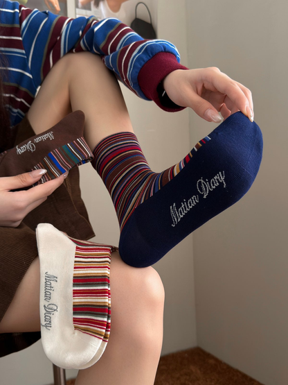 Navy striped crew sock worn with Beige and Brown color samples