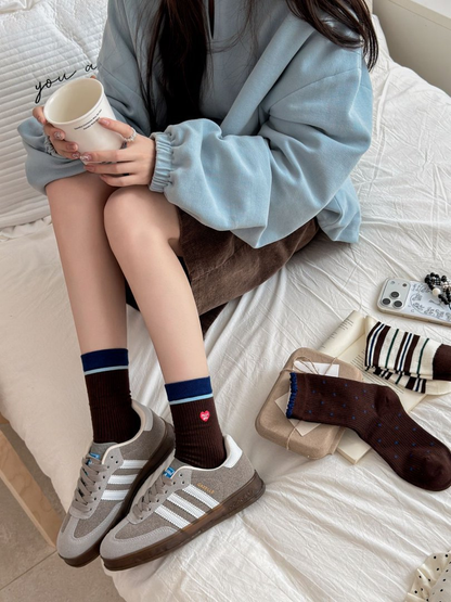Heart Patch brown crew socks worn with gray sneakers