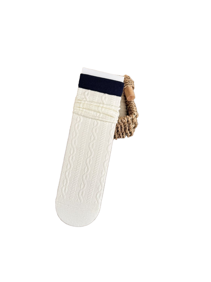 Cable Cuff ivory socks with a navy cuff and cable pattern