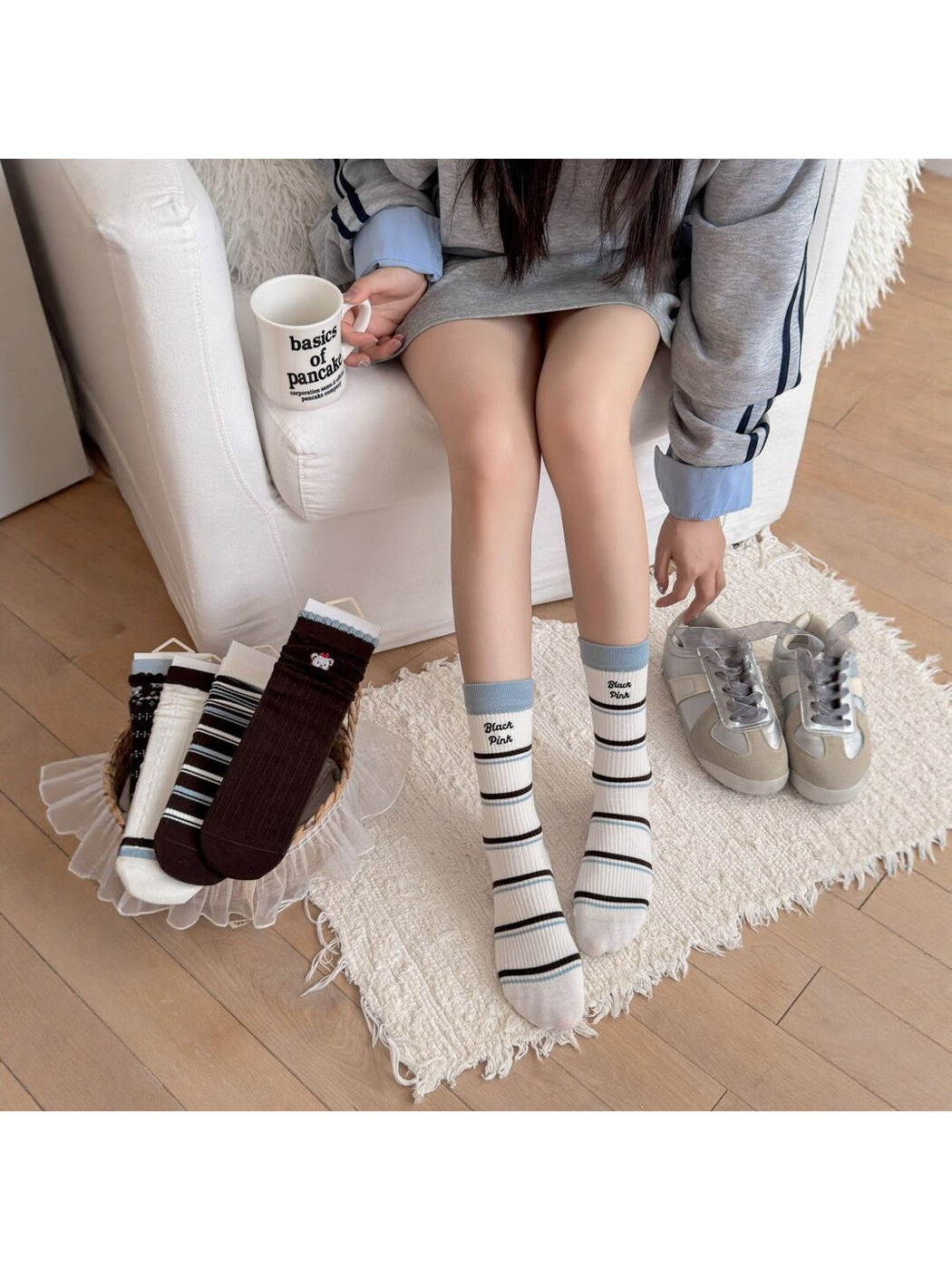 Light Stripes crew socks styled without shoes beside the five sock designs