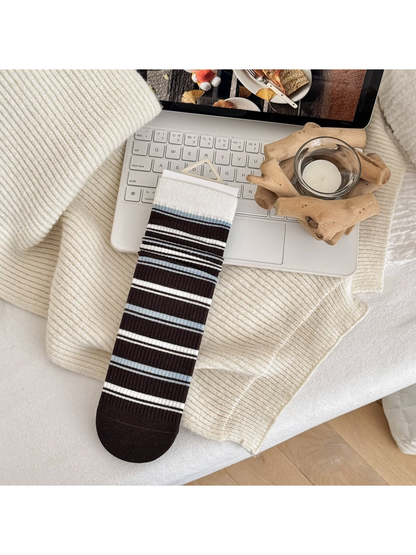 Dark Stripes crew sock in brown with white and light-blue horizontal stripes