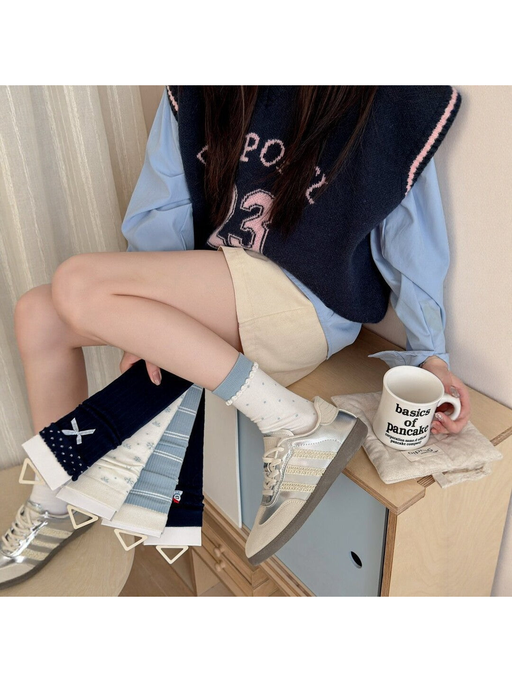 Ivory polka-dot crew socks worn with sneakers beside the five coordinated styles