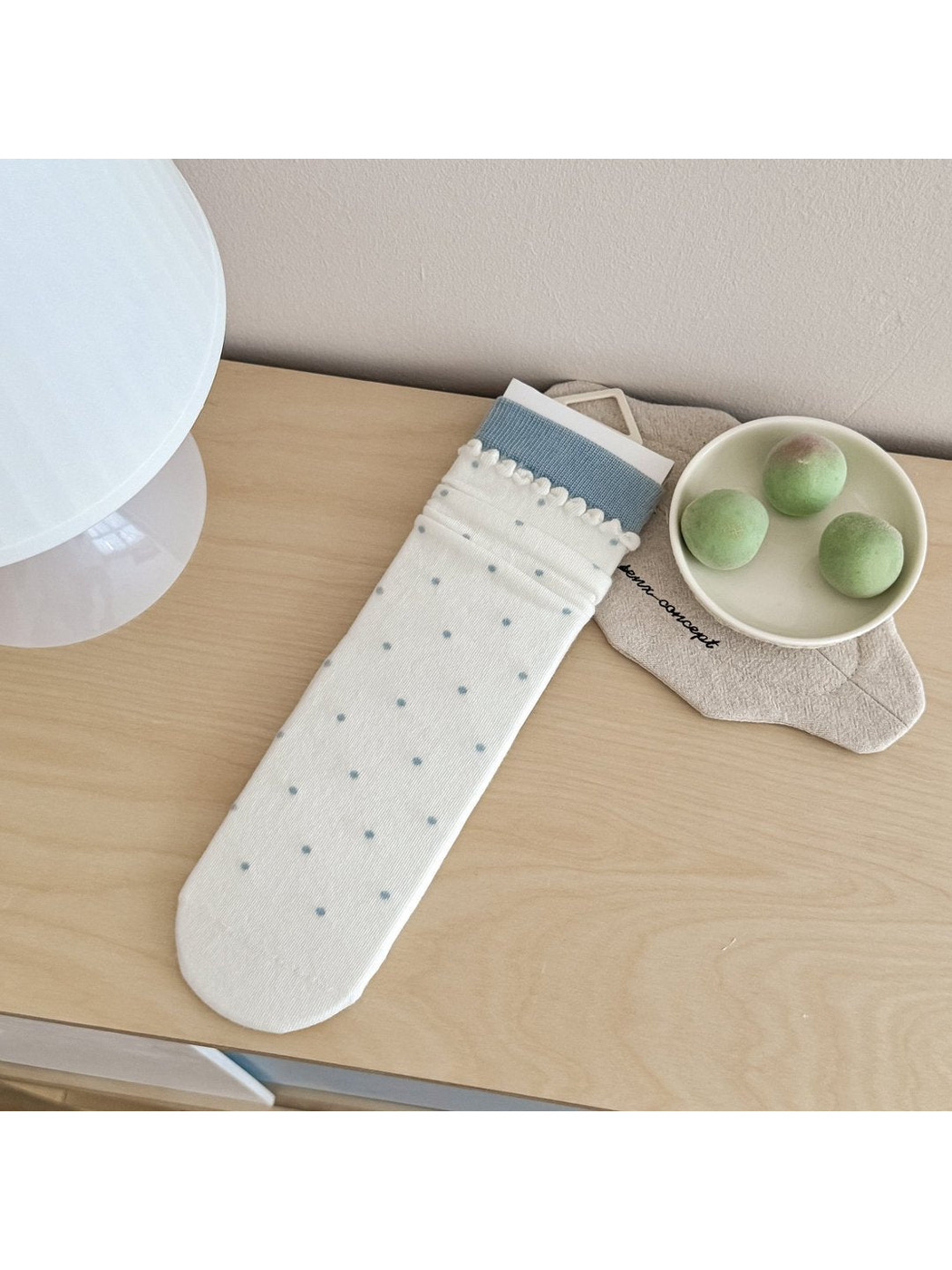 Polka Dots style ivory crew sock with light blue cuff and scalloped trim