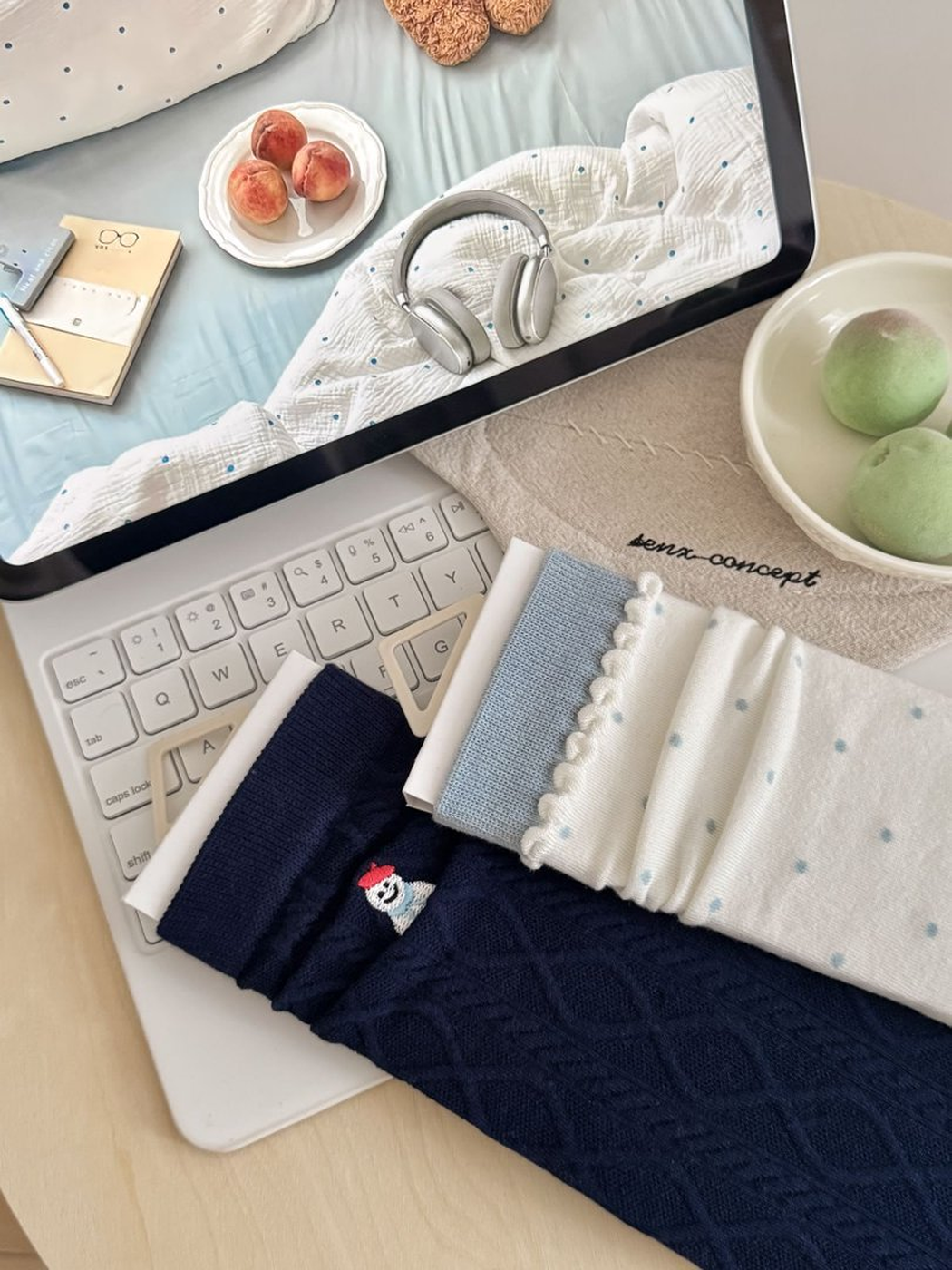Close view of navy snowman cable-knit and ivory polka-dot sock details