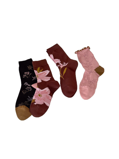 Four floral crew sock styles displayed on a white background