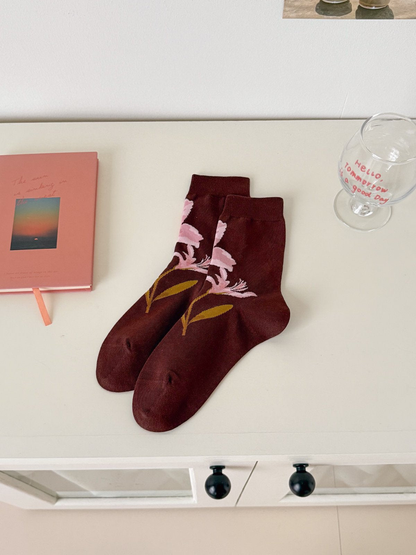 Floral Stem burgundy crew socks with a pink flower and ochre leaves