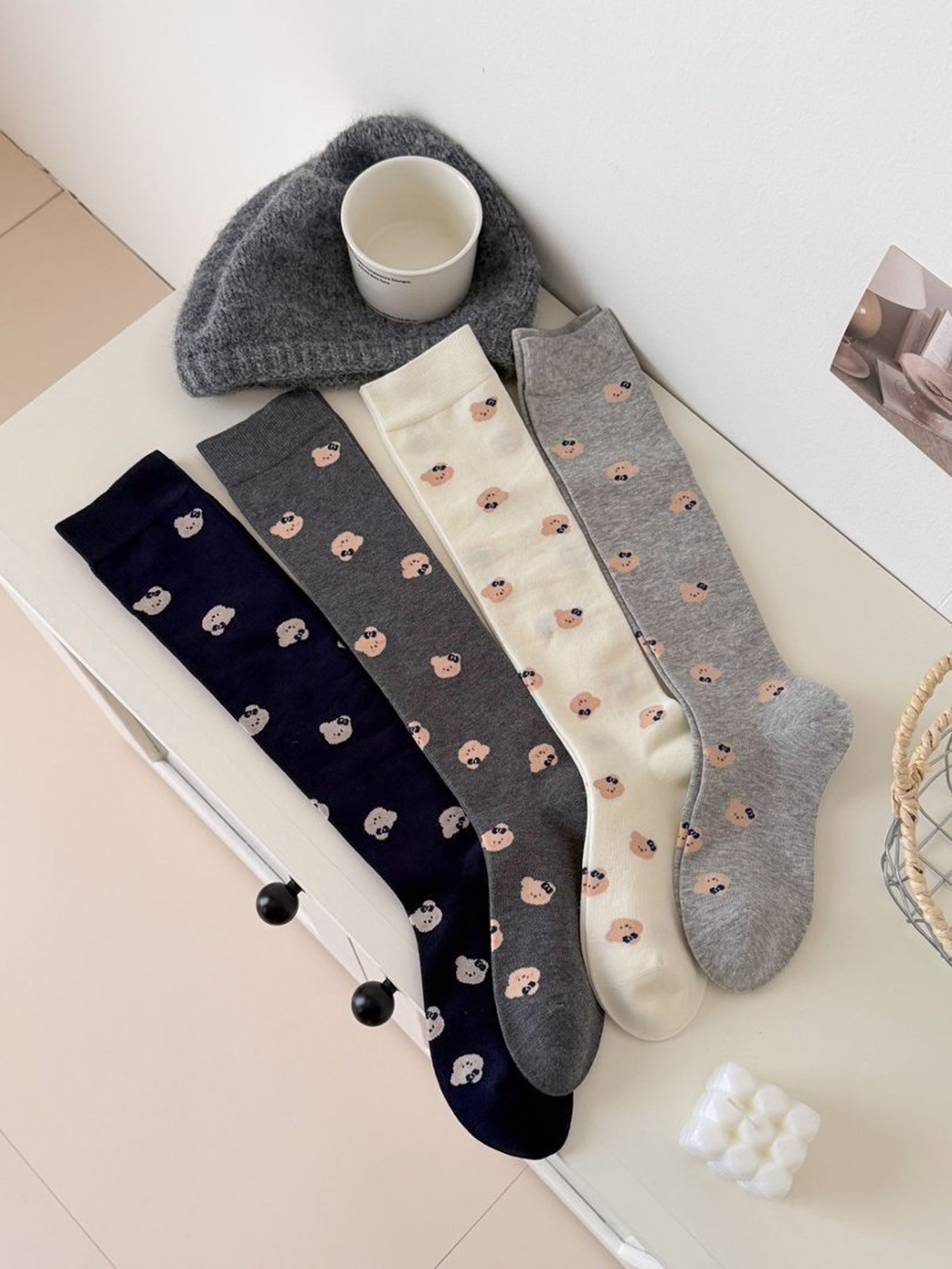 Light Gray, Ivory, Dark Gray and Navy mid-calf socks with repeating bear-face motifs