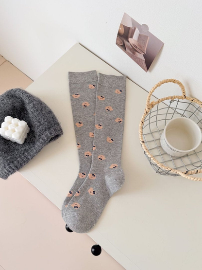Light Gray mid-calf socks with repeating peach bear-face motifs