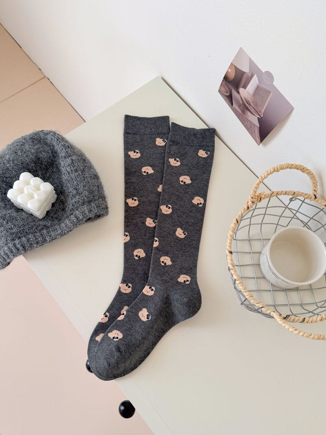 Dark Gray mid-calf socks with repeating peach bear-face motifs