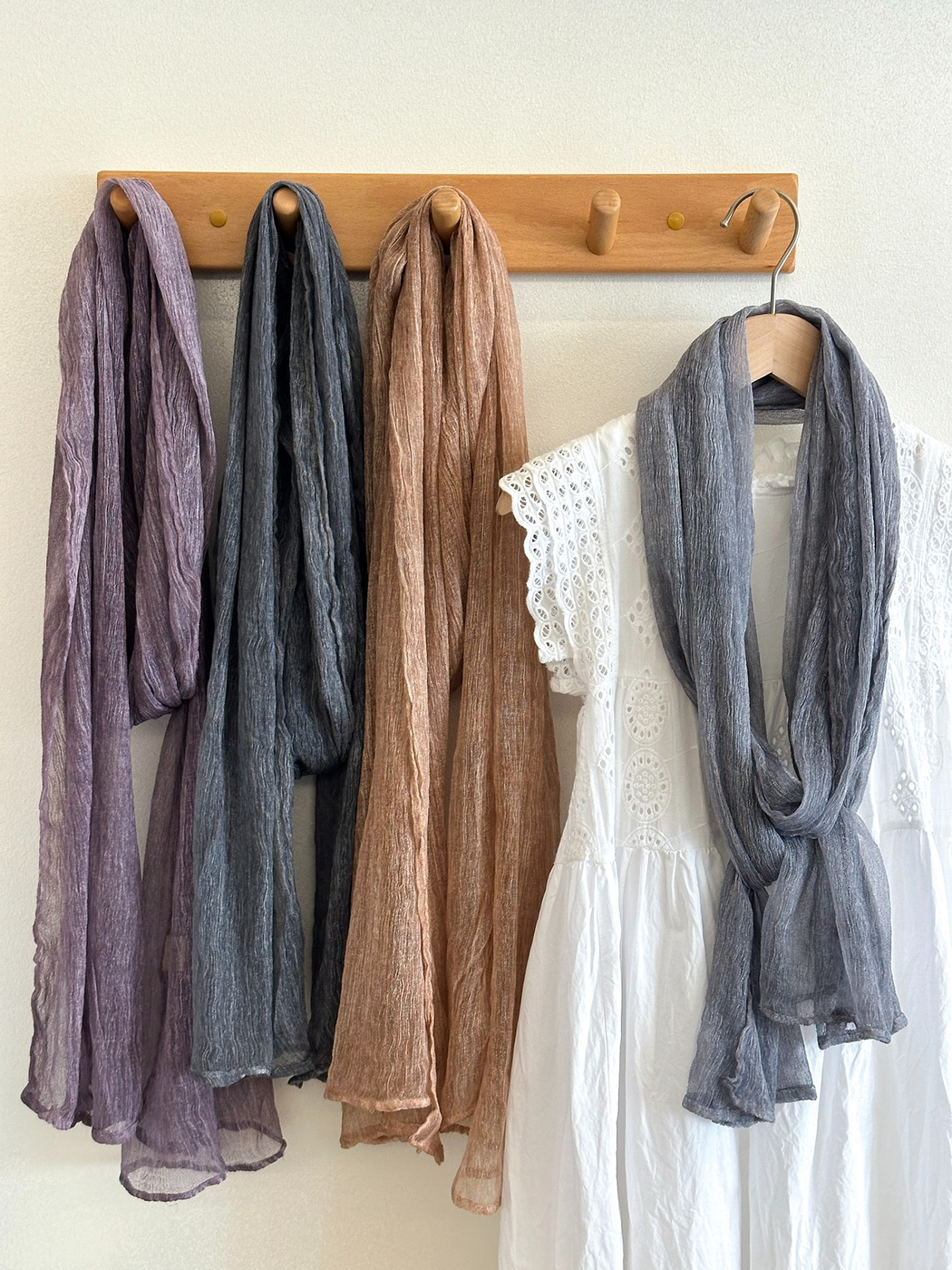 Purple, dark gray, blush pink and gray blue crinkled scarves displayed together