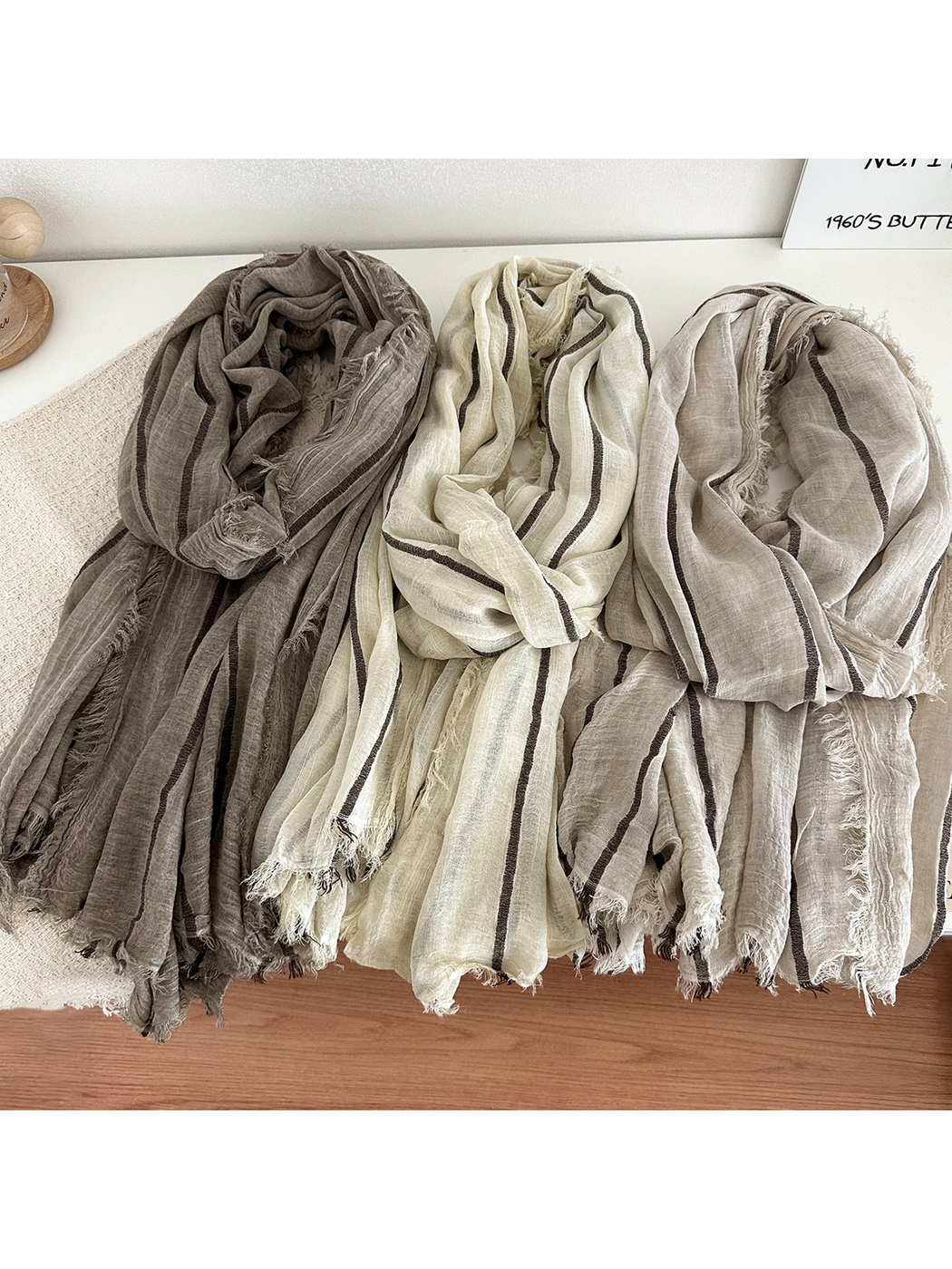 Dark Brown, Off White and Khaki striped scarves arranged side by side