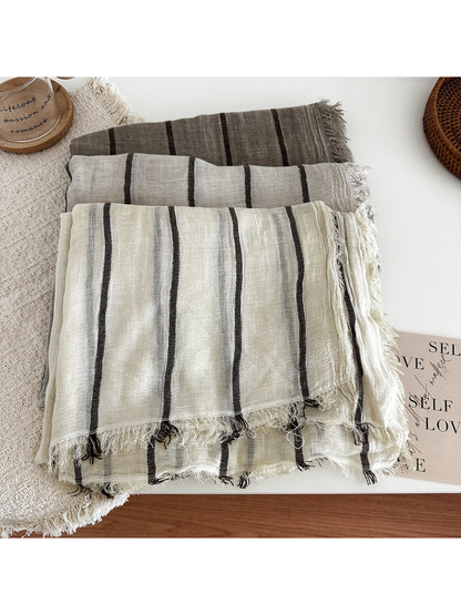 Dark Brown, Khaki and Off White striped scarves folded together