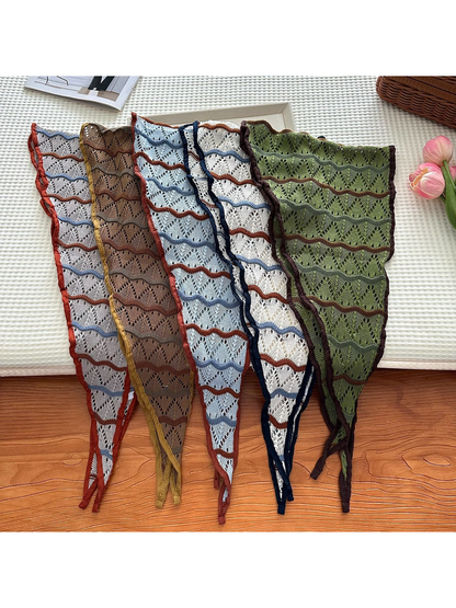 Five openwork triangle scarf colors arranged flat to show their patterns and pointed ends