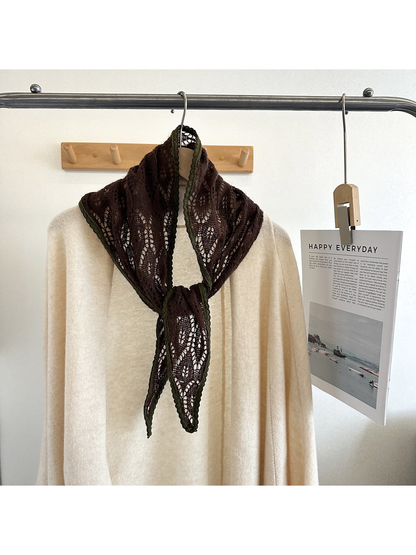 Dark Brown openwork tapered scarf with olive scalloped trim tied over a cream top