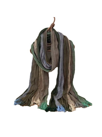 Long crinkled scarf with muted green, gray and blue color blocks and fringed ends