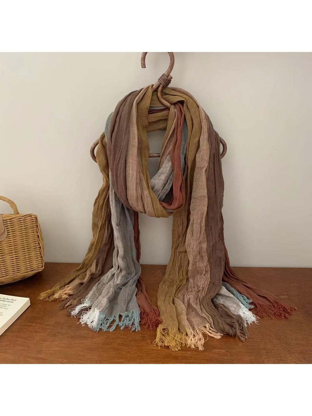 Crinkled multicolor scarf in muted tan, rust and mustard tones with fringed ends