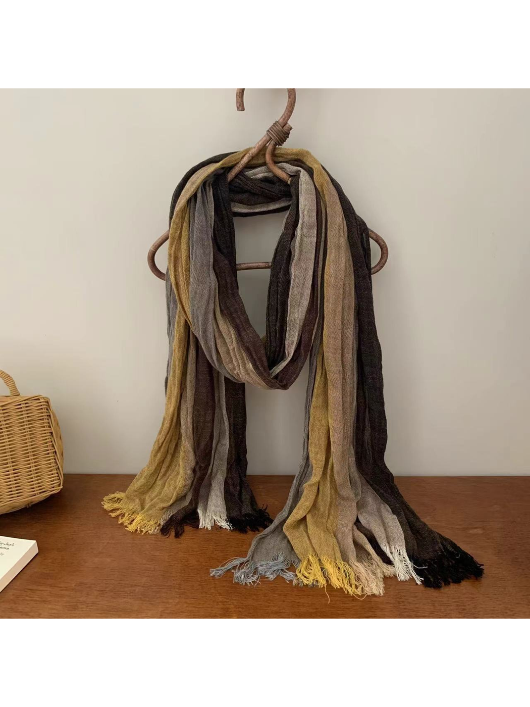 Crinkled multicolor scarf in mustard, taupe, gray and dark brown tones with fringed ends