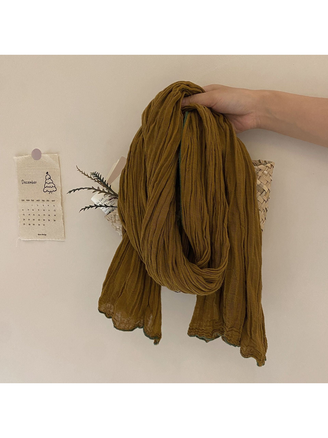 Mustard crinkled scarf with contrasting green edge trim