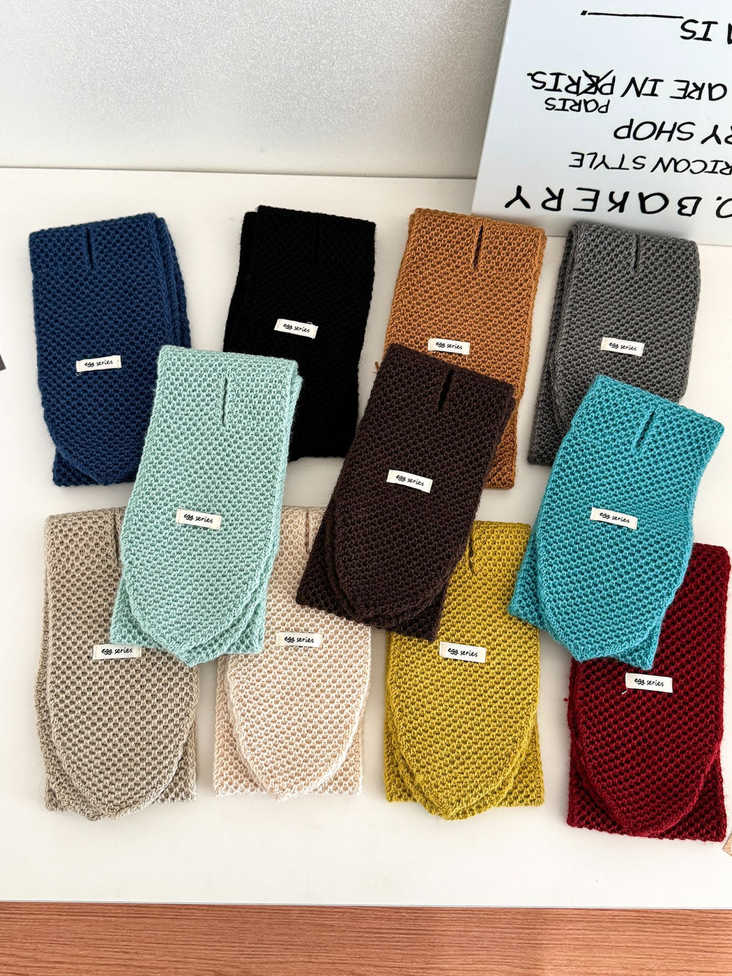 Pull-through scarves in eleven colors arranged together